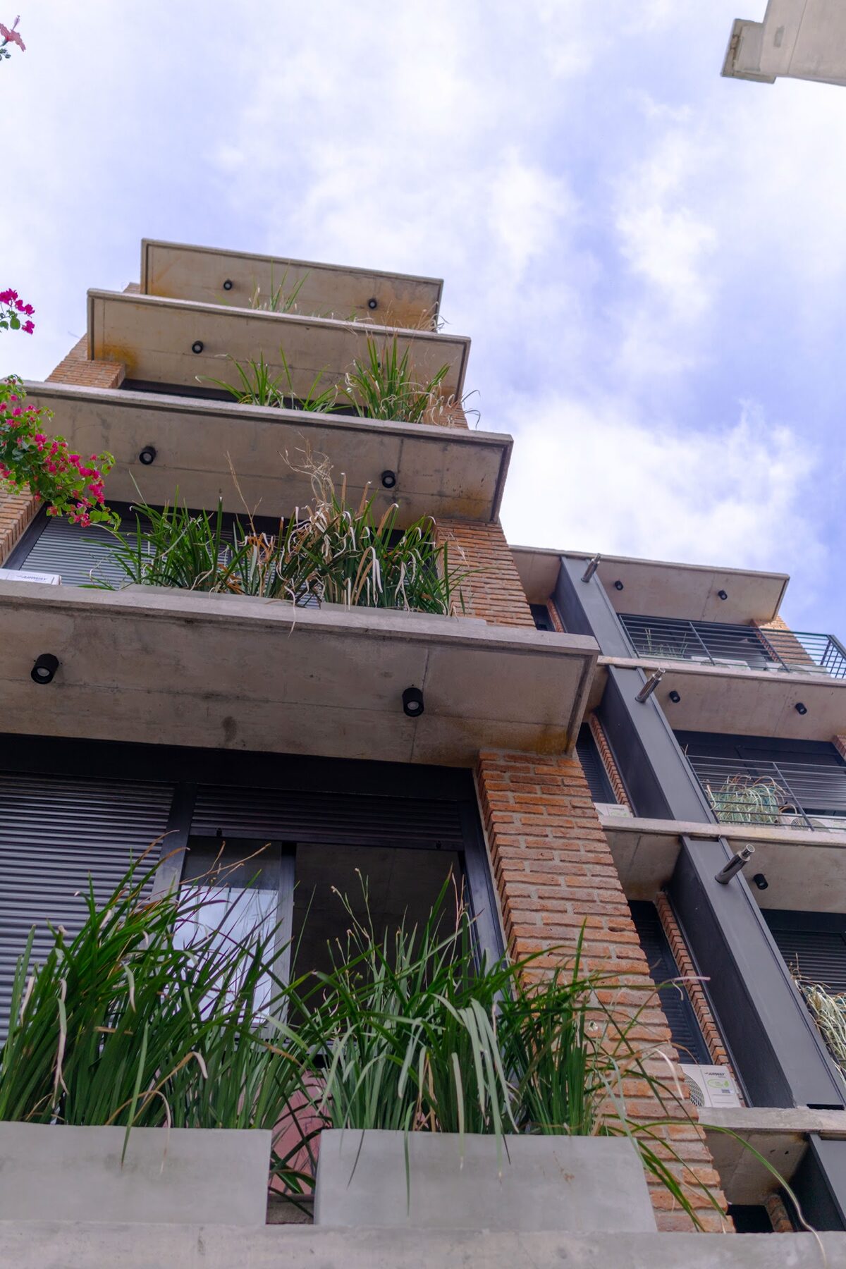 staggered brick balconies with planting
