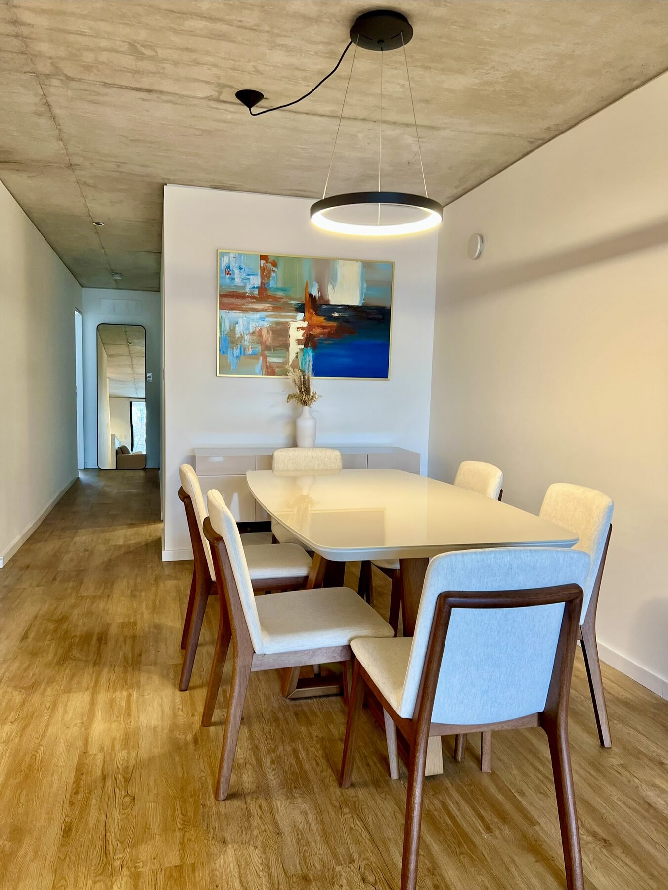 dining room with a wooden table and a pendant light